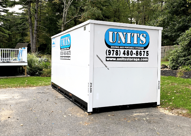 A Units of North Shore container sitting in a driveway.