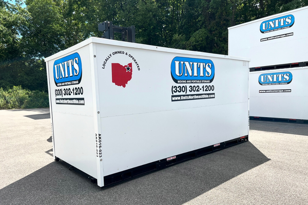 A Units Of Northeast Ohio container in front of two other containers.