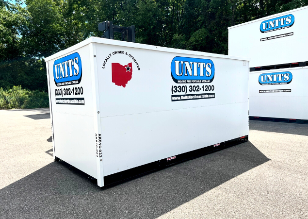 A Units Of Northeast Ohio container on the ground.