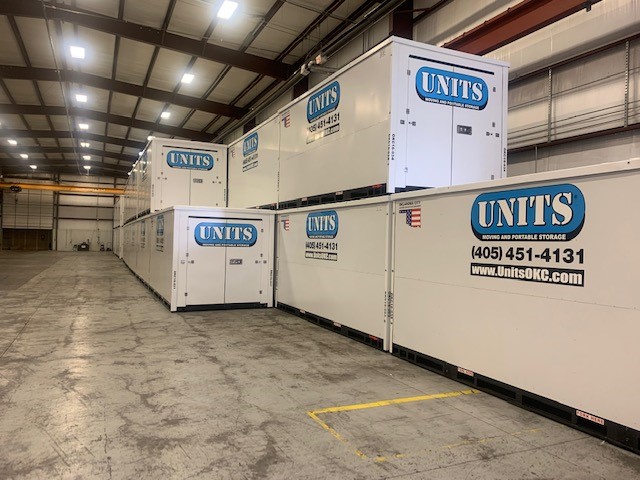 Units of Oklahoma City containers stacked in a warehouse.