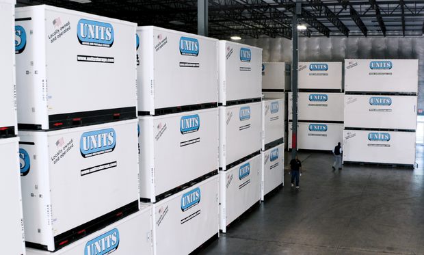 Units of Oklahoma City containers stacked in a warehouse.