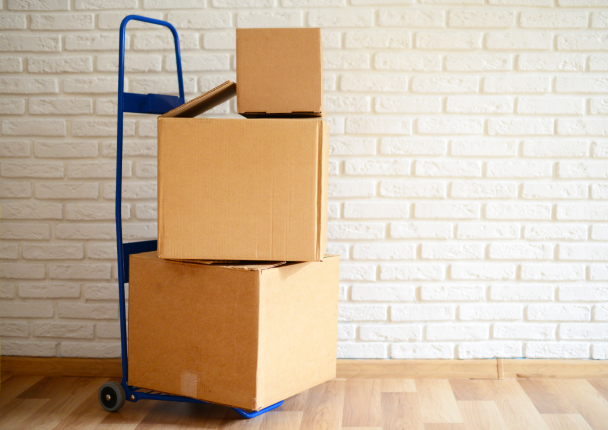 Cardboard boxes stacked in a room.