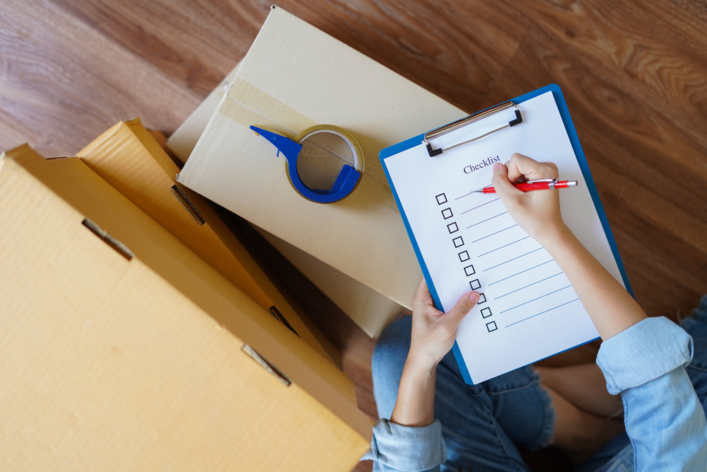 Person marking off a checklist.