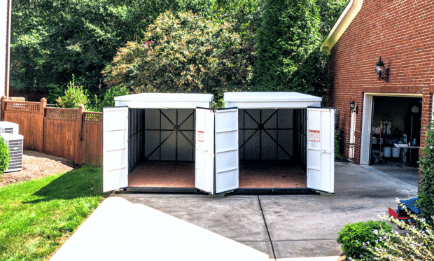 Two UNITS Moving and Portable Storage containers in a driveway.