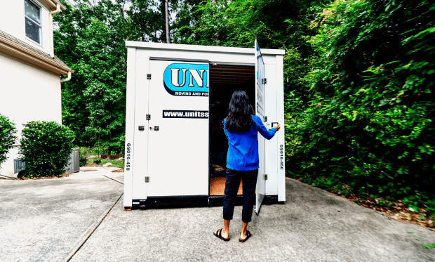 Woman opening up her UNITS Moving and Portable Storage container.