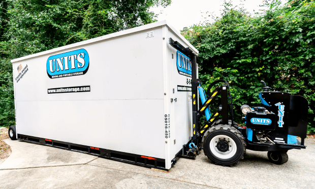 ROBO-UNIT moving a UNITS Moving and Portable Storage container.