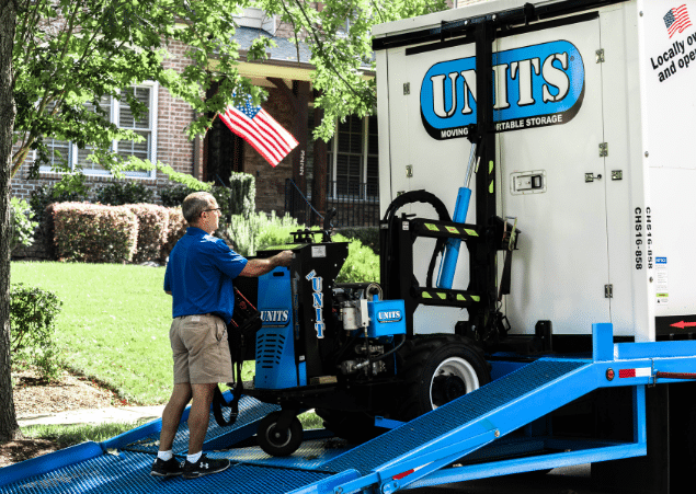 Man using a ROBO-UNIT to move a UNITS Moving and Portable Storage container.