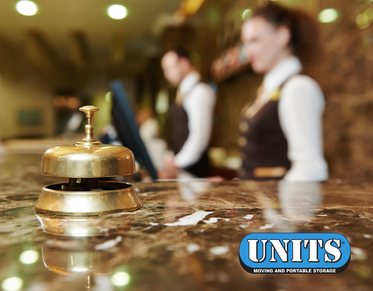 picture of front desk of a hotel with UNITS logo