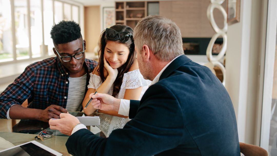 Couple sitting together getting advice from an expert.