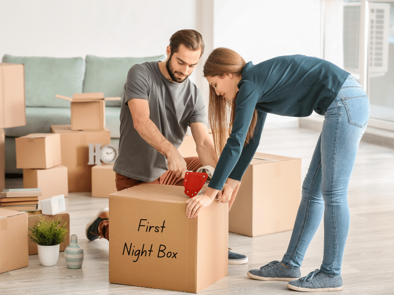 couple packing a First Night Box