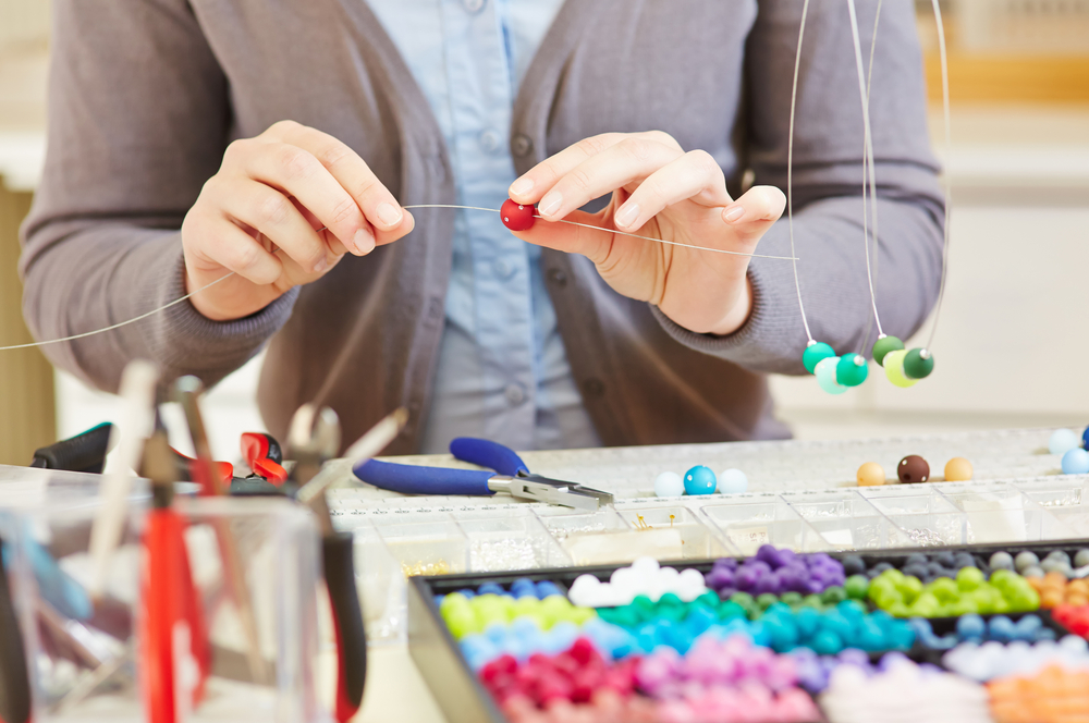 Woman doing an arts and crafts project.