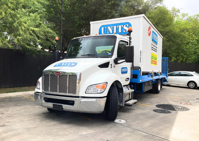 UNITS of San Antonio portable storage delivery truck parked in the street.