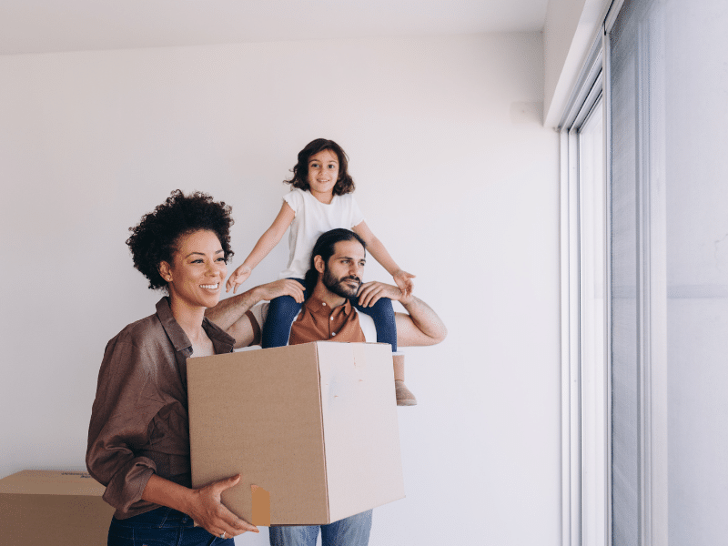 a family Moving in the Spring looking out of window in new home