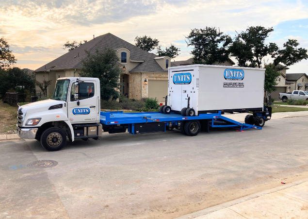 UNITS of San Diego's portable storage container being delivered to a home for storage and moving needs.