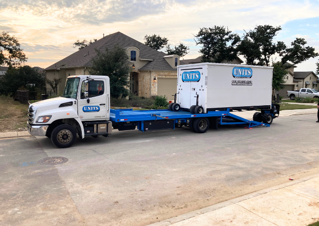 UNITS of San Diego portable storage delivery truck with portable storage container on the truck.