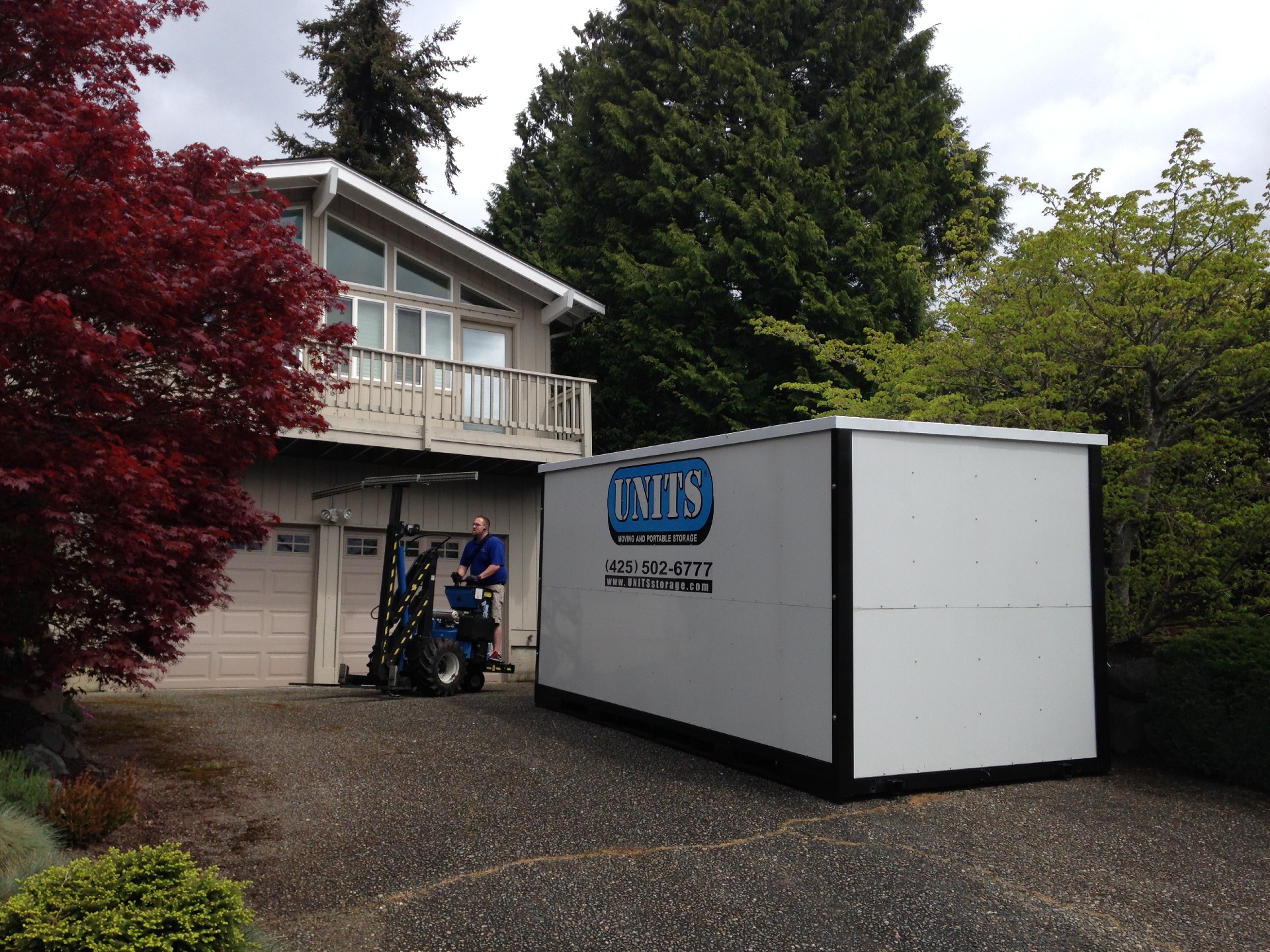 UNITS Moving and Portable Storage container in a driveway.