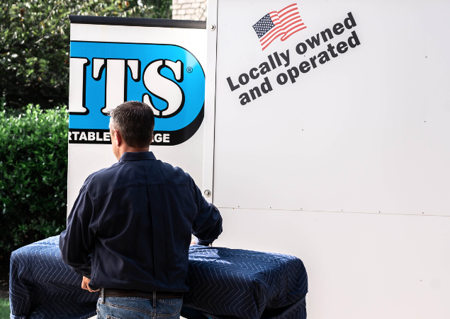 Man moving his belongings into a UNITS Moving and Portable Storage container.