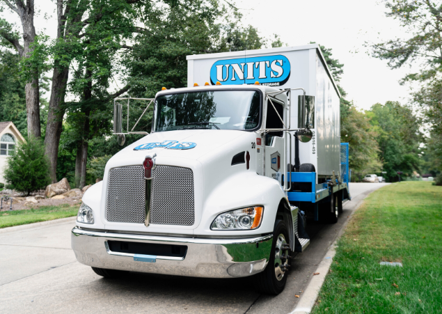 UNITS Moving and Portable Storage truck carrying a portable storage container.