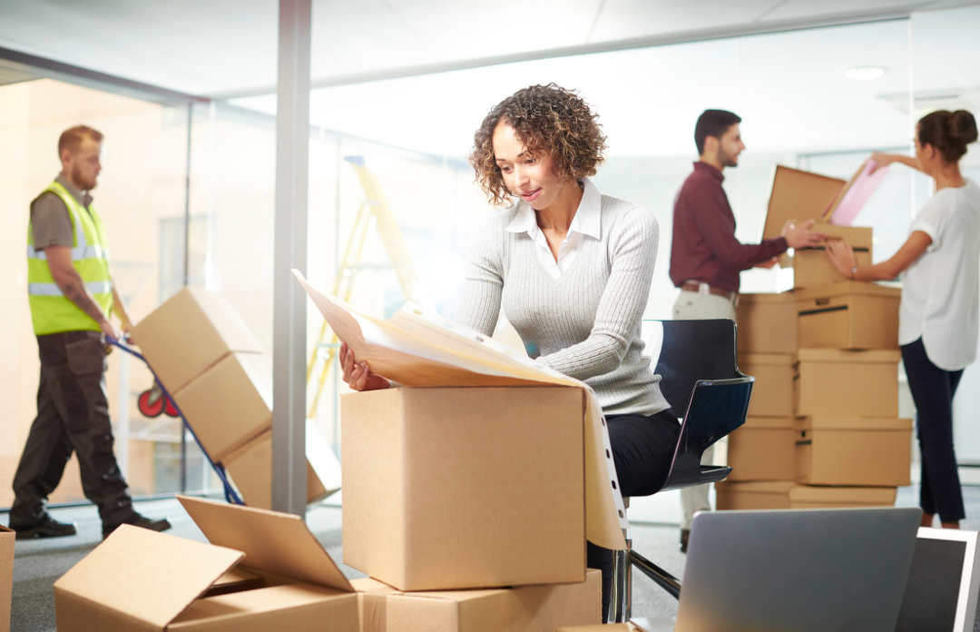 Moving Offices. Lady looking at her plans in southeast Michigan