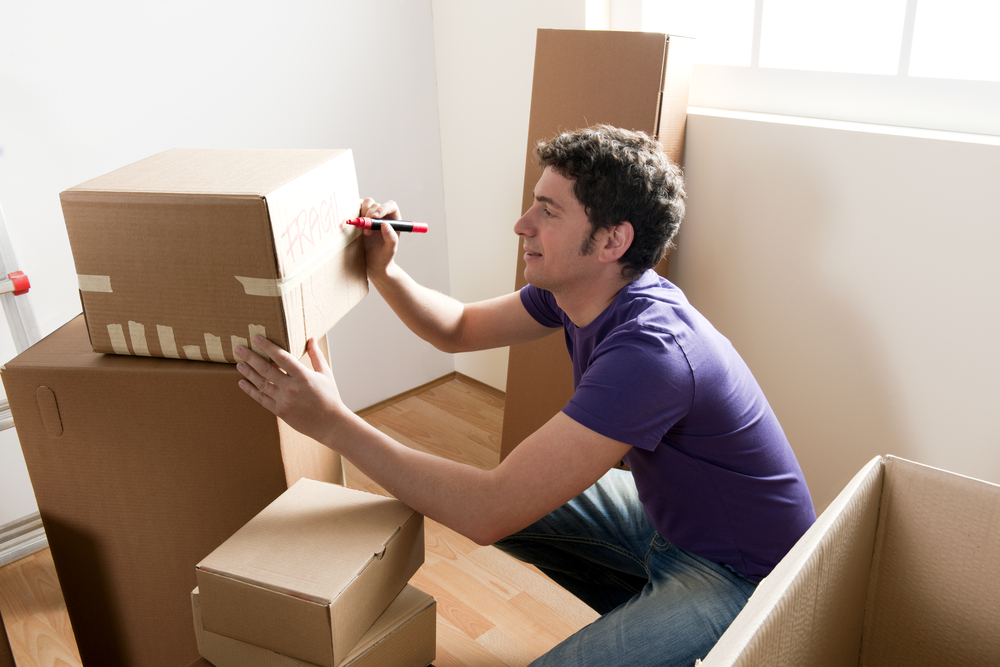 Units of Tampa Bay man writing fragile on box