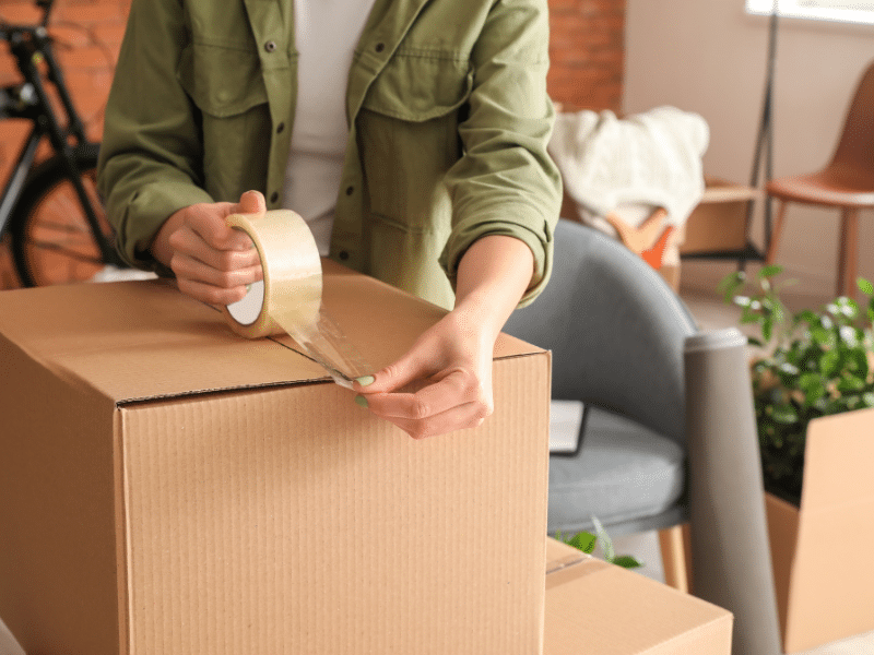 Units of Tampa Bay woman packing items for new house