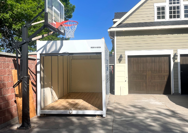 Units Of Utah container sitting in the driveway of a house.