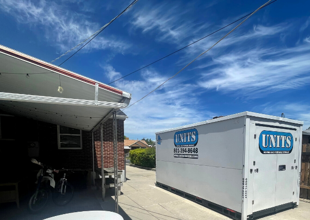 Units Of Utah container sitting in a driveway.