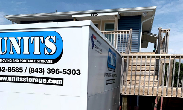 Units of Wilmington container sitting outside of house.