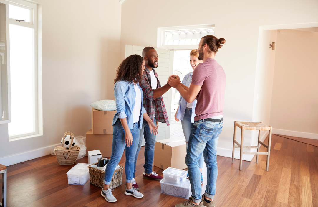 Friends helping each other move.