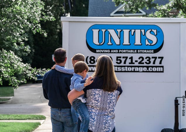 Family admiring their UNITS moving and portable storage container.